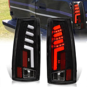 Chevrolet C/K 1988-1999 / Suburban 1992-1999 / Tahoe 1995-1999 / Blazer Full Size 1992-1994 / GMC C/K 1988-1999 / Yukon 1992-1999 / Cadillac Escalade 1999-2000 LED Bar Tail Lights Black Housing Clear Len White Tube - Parts Agent